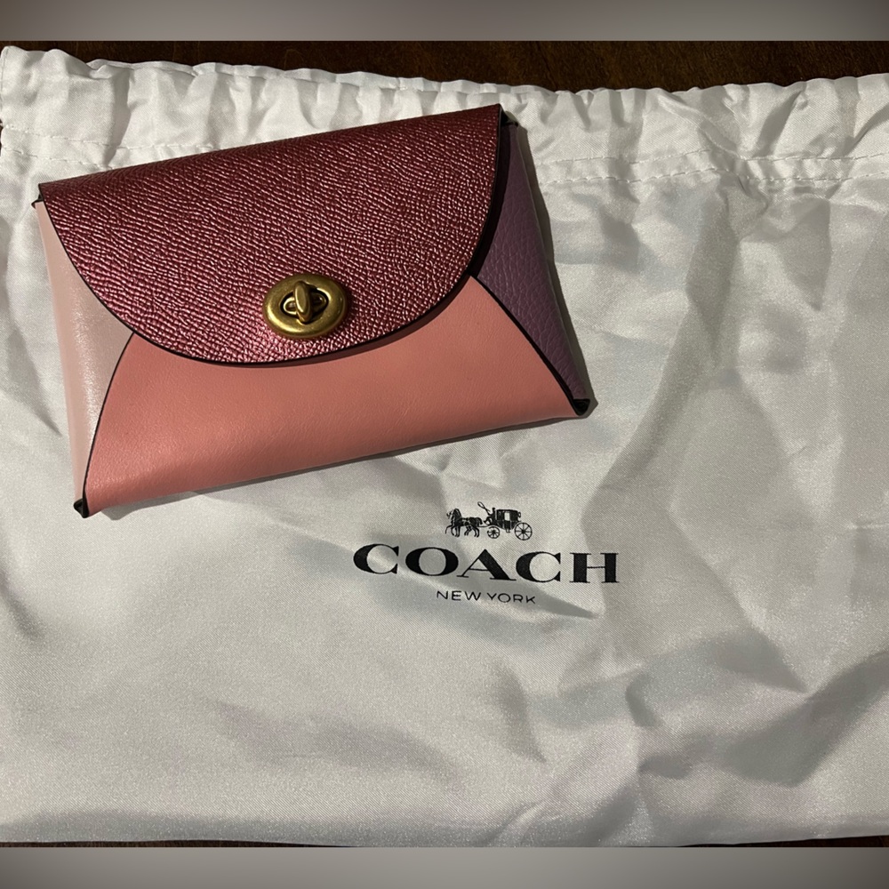Never used, Coach (Re)Loved Medium color block pouch in pink